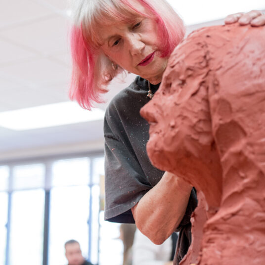 Continuing education student at a ceramics class