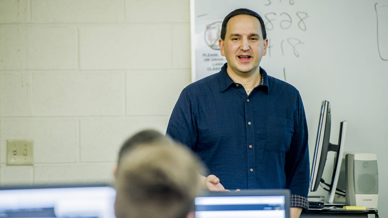 professor teaching a computer class