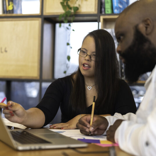 student works with aid counselor