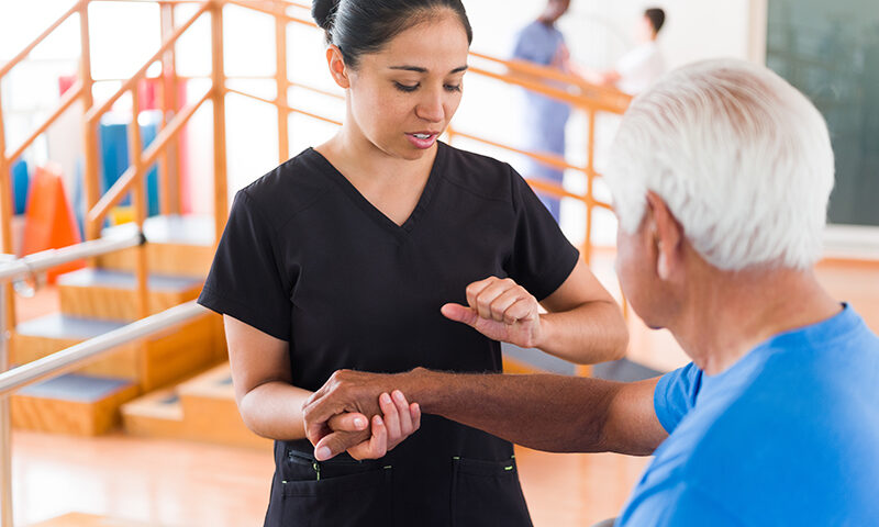 Occupational therapist working with a patient